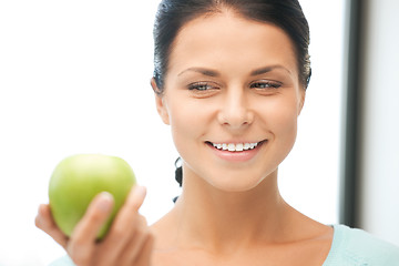 Image showing lovely housewife with green apple