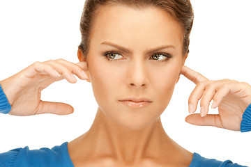 Image showing woman with fingers in ears