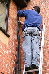 Image showing Worker on a ladder