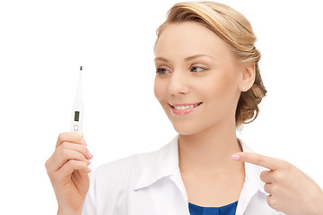 Image showing attractive female doctor with thermometer