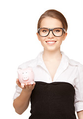 Image showing lovely woman with piggy bank