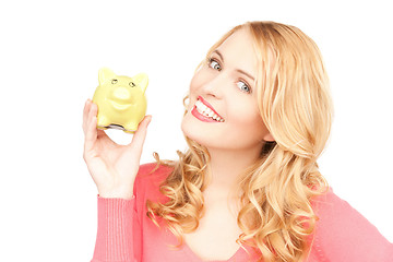 Image showing lovely woman with piggy bank
