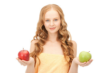 Image showing young beautiful woman with green and red apples