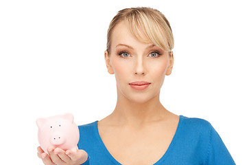 Image showing lovely woman with piggy bank