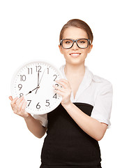 Image showing woman holding big clock