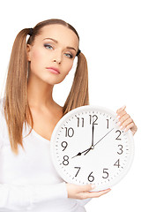 Image showing woman holding big clock