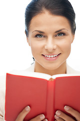 Image showing happy and smiling woman with book