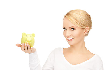 Image showing lovely woman with piggy bank