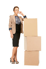 Image showing attractive businesswoman with big boxes