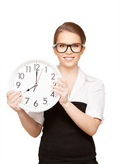 Image showing woman holding big clock