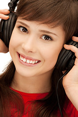 Image showing happy teenage girl in big headphones