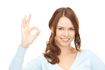 Image showing lovely teenage girl showing ok sign