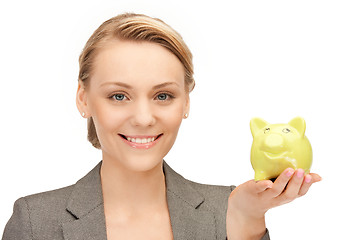 Image showing lovely woman with piggy bank