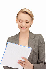 Image showing happy woman with big notepad