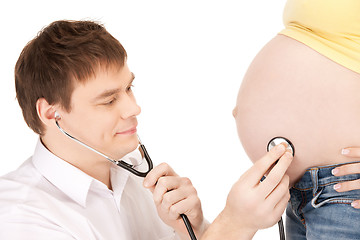 Image showing doctor and pregnant woman belly