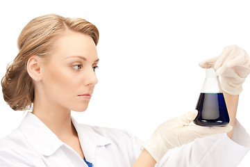 Image showing lab worker holding up test tube