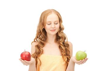 Image showing young beautiful woman with green and red apples