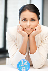 Image showing businesswoman with clock