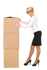 Image showing attractive businesswoman with big boxes