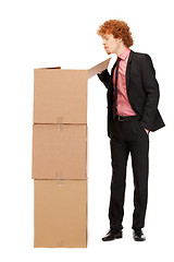 Image showing attractive businessman with big boxes