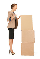 Image showing attractive businesswoman with big boxes