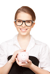 Image showing lovely woman with piggy bank