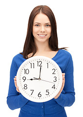 Image showing woman holding big clock