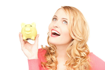 Image showing lovely woman with piggy bank