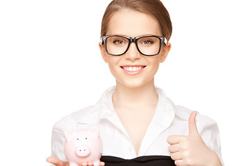 Image showing lovely woman with piggy bank