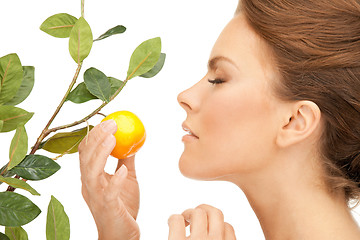 Image showing lovely woman with lemon twig