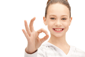 Image showing lovely teenage girl showing ok sign