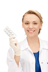 Image showing attractive female doctor with pills