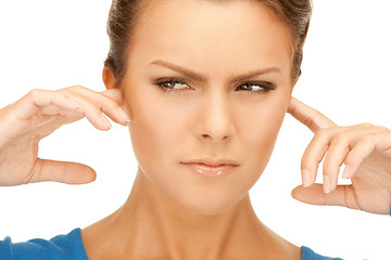 Image showing woman with fingers in ears