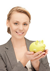 Image showing lovely woman with piggy bank