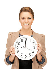 Image showing woman holding big clock