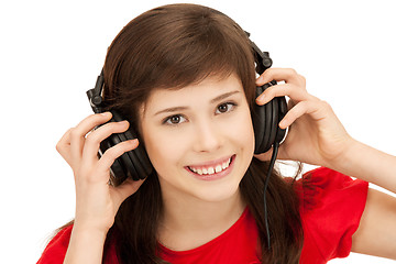 Image showing happy teenage girl in big headphones