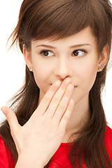 Image showing teenage girl with palms over mouth