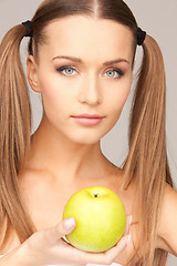 Image showing young beautiful woman with green apple