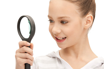 Image showing teenage girl with magnifying glass