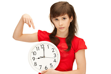 Image showing teenage girl holding big clock