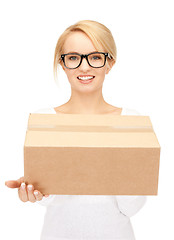 Image showing attractive businesswoman with cardboard box