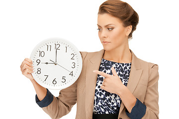 Image showing woman holding big clock