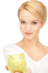 Image showing lovely woman with piggy bank