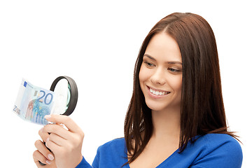 Image showing woman with magnifying glass and euro cash money