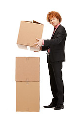 Image showing attractive businessman with big boxes