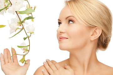 Image showing beautiful woman with orchid flower