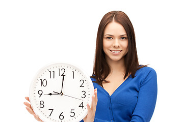 Image showing woman holding big clock