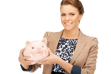 Image showing lovely woman with piggy bank