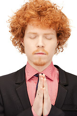 Image showing praying businessman