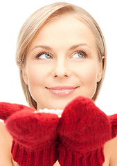 Image showing woman in mittens with snow